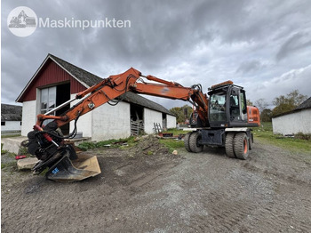 حفارة على عجلات HITACHI ZX140W-3