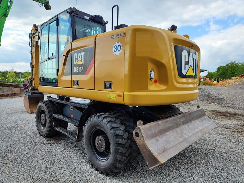 Caterpillar M316F - حفارة على عجلات: صور 1 Caterpillar M316F - حفارة على عجلات: صور 1