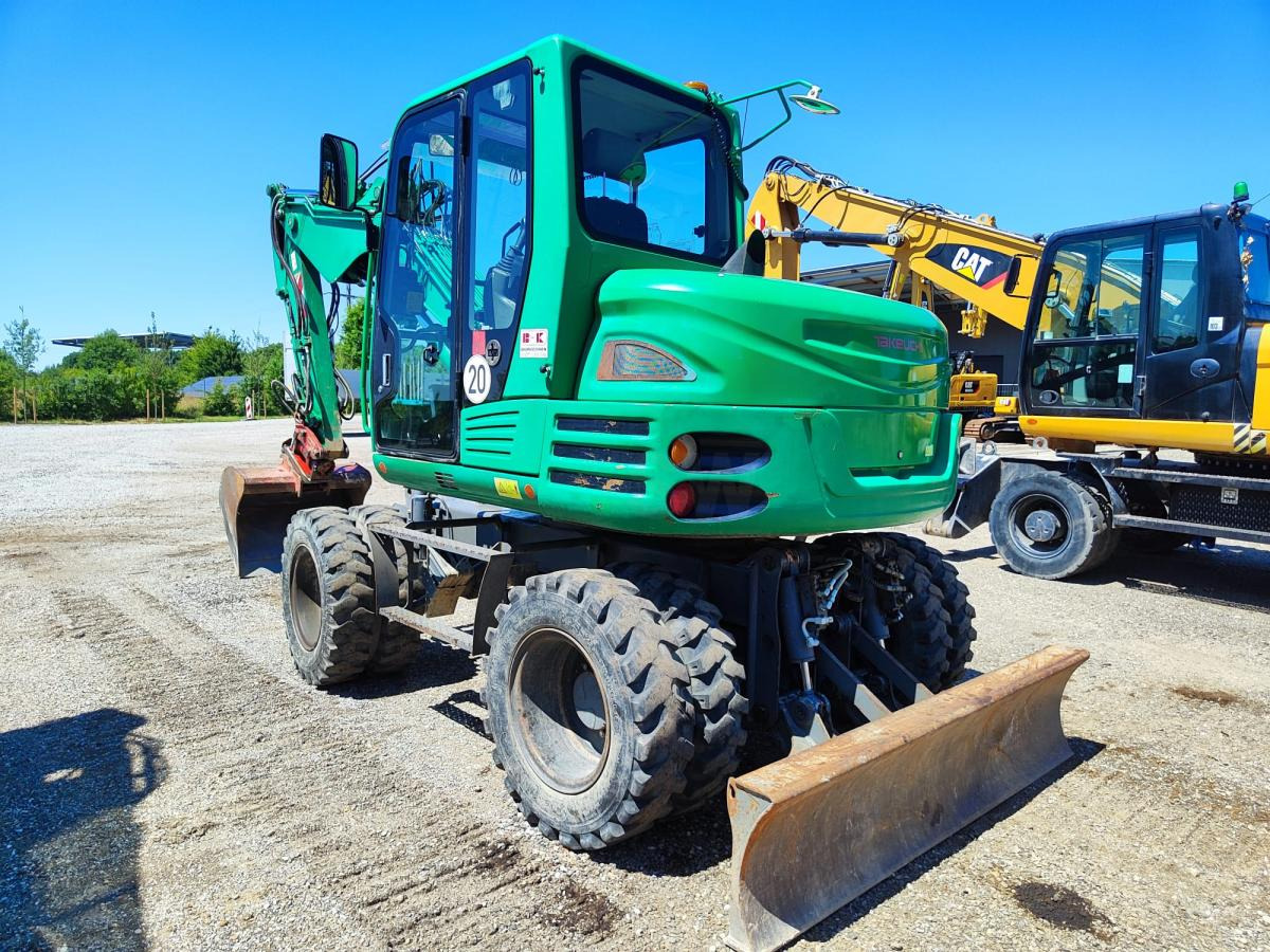 Takeuchi TB295W - حفارة على عجلات: صور 1 Takeuchi TB295W - حفارة على عجلات: صور 1