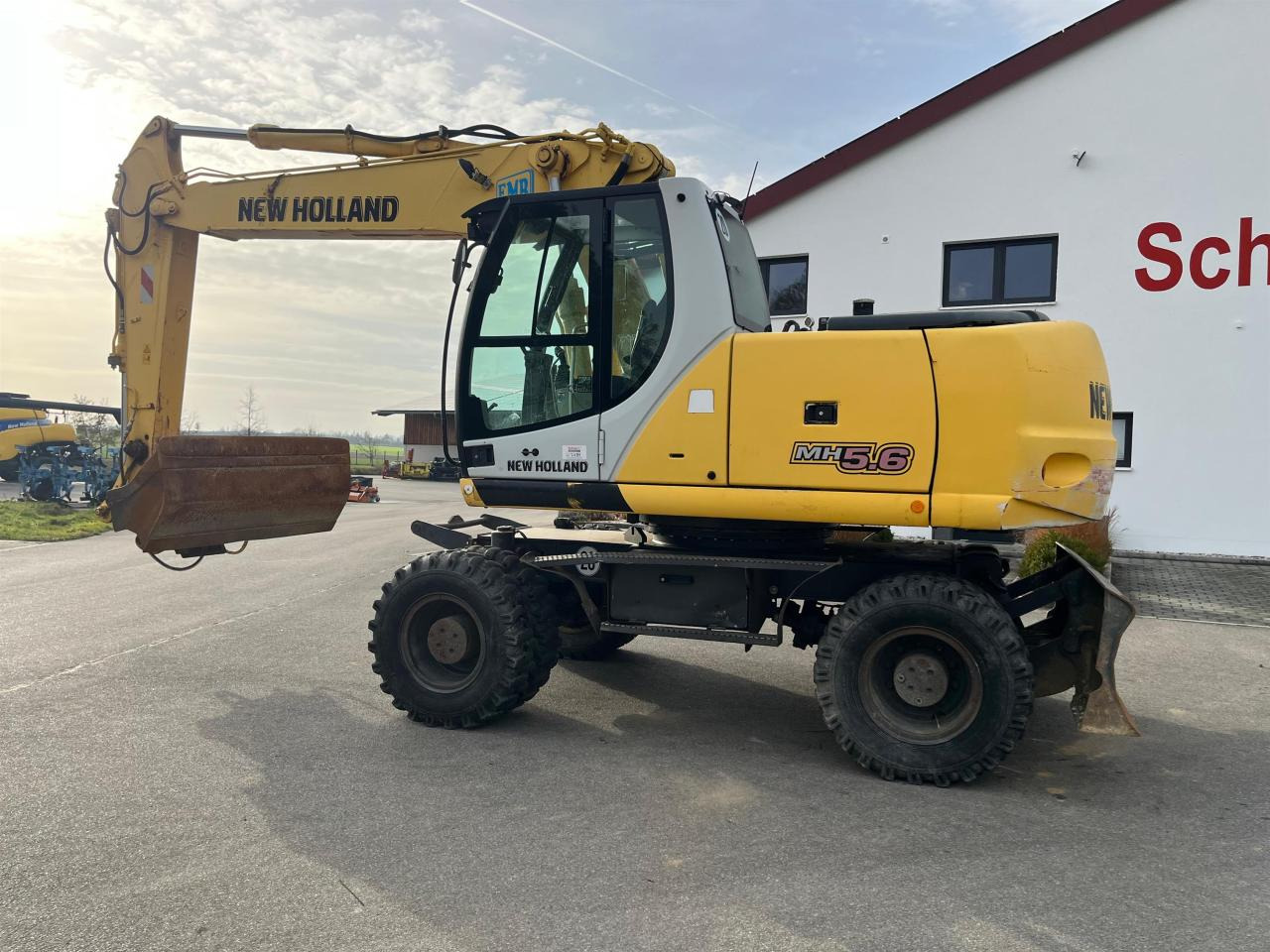 New Holland MH 5.6 inkl. Grabenlöffel, Tieflöffel - حفارة على عجلات: صور 4 New Holland MH 5.6 inkl. Grabenlöffel, Tieflöffel - حفارة على عجلات: صور 4