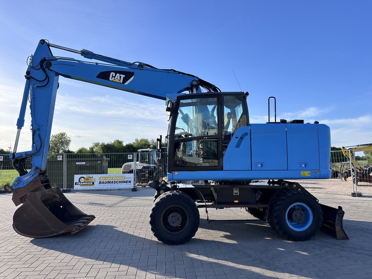 CATERPILLAR M 318 F Oil Quick OQ 65 Deutsche Maschine Top ! - حفارة على عجلات: صور 1 CATERPILLAR M 318 F Oil Quick OQ 65 Deutsche Maschine Top ! - حفارة على عجلات: صور 1