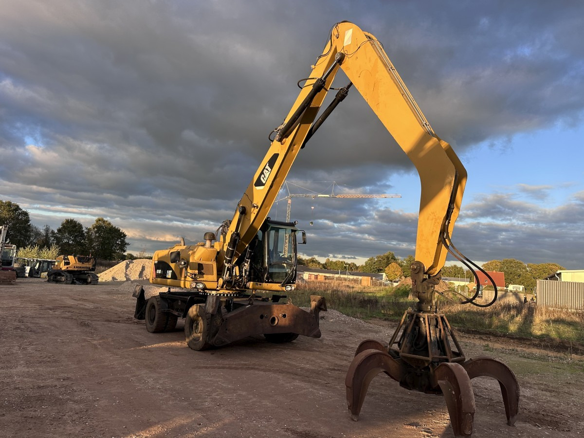 CATERPILLAR M 318 MH mit Greifer Kein 3022 3026 320 322 - حفارة على عجلات: صور 2 CATERPILLAR M 318 MH mit Greifer Kein 3022 3026 320 322 - حفارة على عجلات: صور 2
