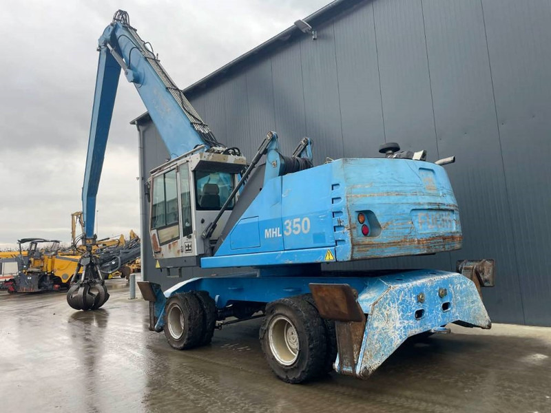 Fuchs MHL350 - حفارة النقل والشحن: صور 3 Fuchs MHL350 - حفارة النقل والشحن: صور 3