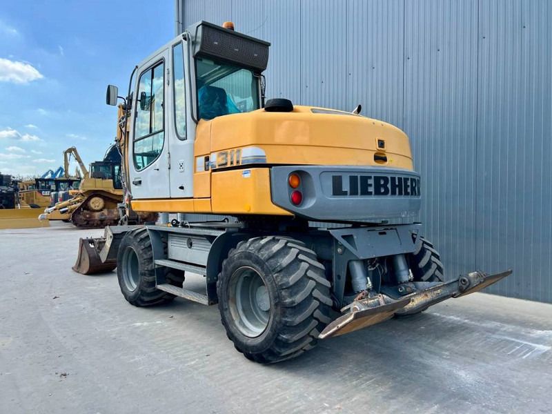 Liebherr A311 Litronic - حفارة على عجلات: صور 2 Liebherr A311 Litronic - حفارة على عجلات: صور 2