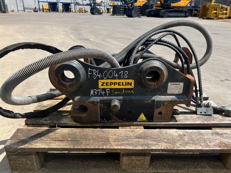 OilQuick OQ65 - M314F / M316F / M318F - وصلة الربط للمعدات المعلقة - آلات البناء: صور 4 OilQuick OQ65 - M314F / M316F / M318F - وصلة الربط للمعدات المعلقة - آلات البناء: صور 4