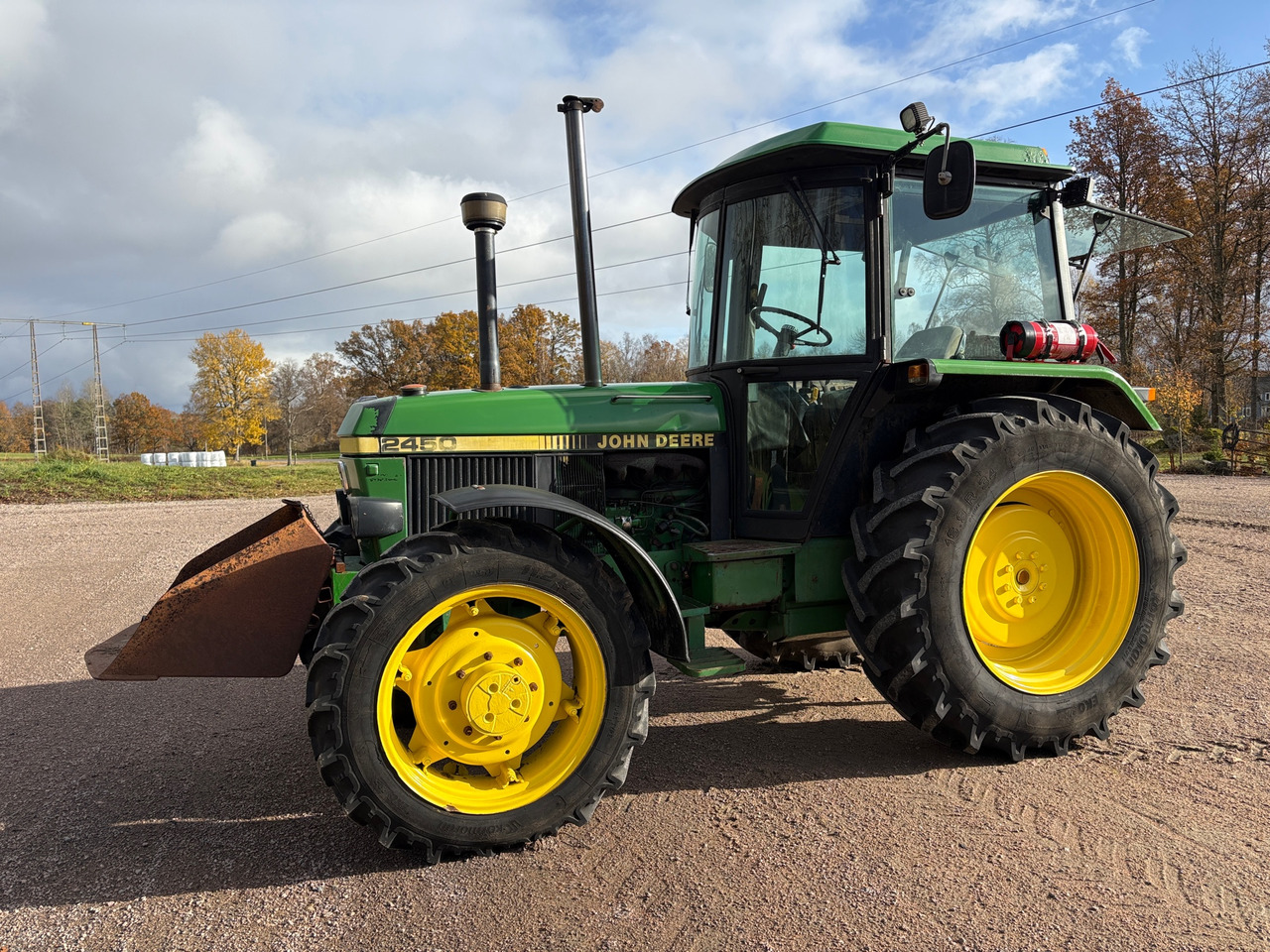 John Deere 2450 - جرار: صور 1 John Deere 2450 - جرار: صور 1