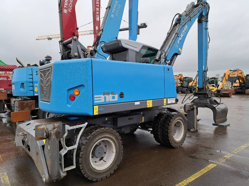 Fuchs MHL 310 - حفارة النقل والشحن: صور 1 Fuchs MHL 310 - حفارة النقل والشحن: صور 1