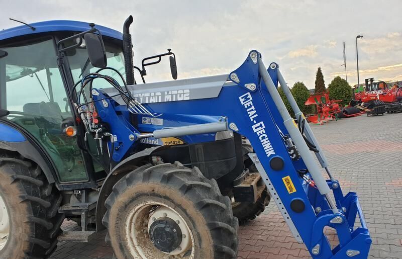 Metal-Technik für NEW HOLLAND TL 90 - لوادر وحفارات أمامية: صور 3 Metal-Technik für NEW HOLLAND TL 90 - لوادر وحفارات أمامية: صور 3