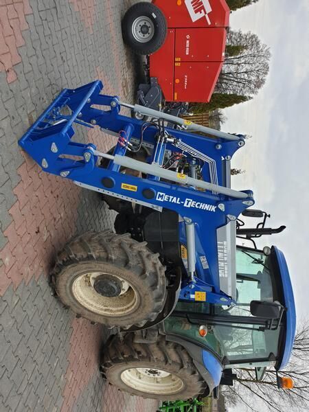 Metal-Technik für NEW HOLLAND TL 90 - لوادر وحفارات أمامية: صور 1 Metal-Technik für NEW HOLLAND TL 90 - لوادر وحفارات أمامية: صور 1