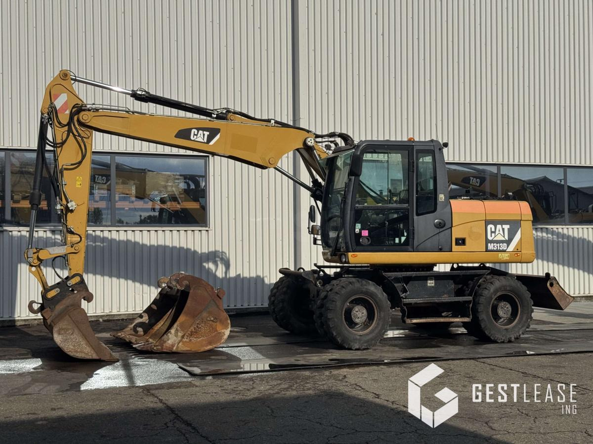 Caterpillar M313D - حفارة على عجلات: صور 1 Caterpillar M313D - حفارة على عجلات: صور 1