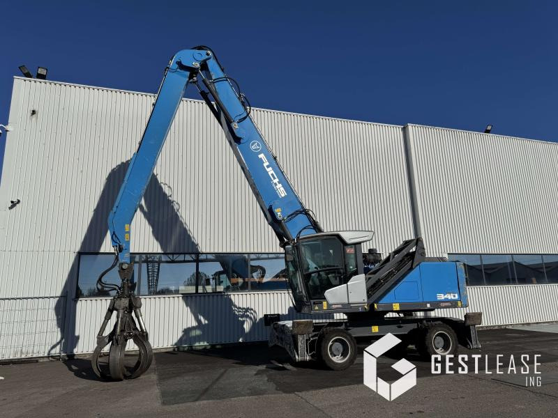 Fuchs MHL340F - حفارة النقل والشحن: صور 1 Fuchs MHL340F - حفارة النقل والشحن: صور 1