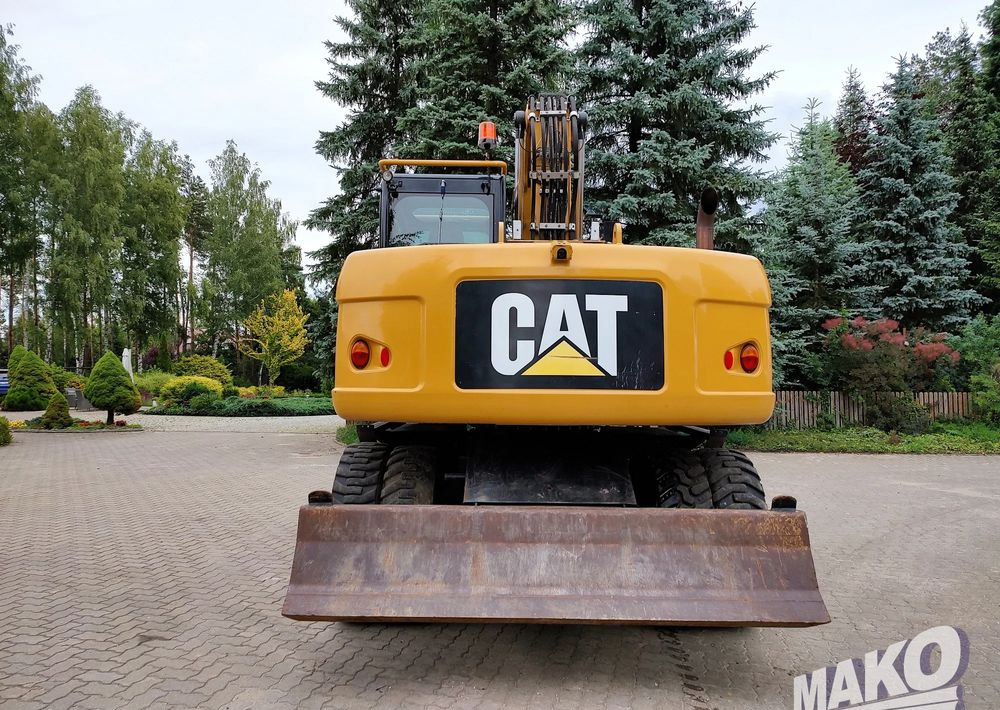 Caterpillar M313D - حفارة على عجلات: صور 3 Caterpillar M313D - حفارة على عجلات: صور 3
