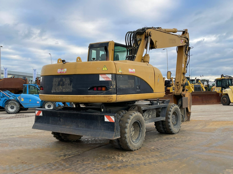 Caterpillar M318C - حفارة على عجلات: صور 5 Caterpillar M318C - حفارة على عجلات: صور 5