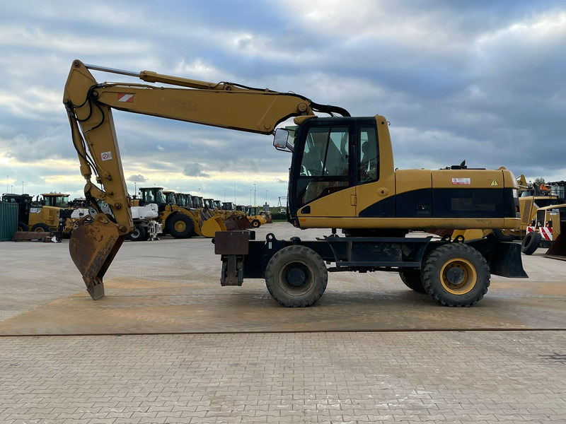 Caterpillar M318C - حفارة على عجلات: صور 1 Caterpillar M318C - حفارة على عجلات: صور 1