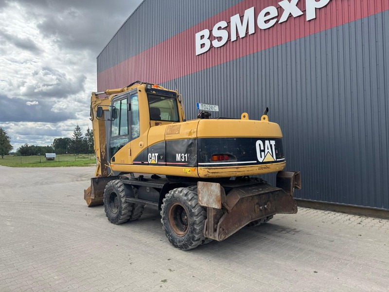 Caterpillar M 315 C - حفارة على عجلات: صور 4 Caterpillar M 315 C - حفارة على عجلات: صور 4
