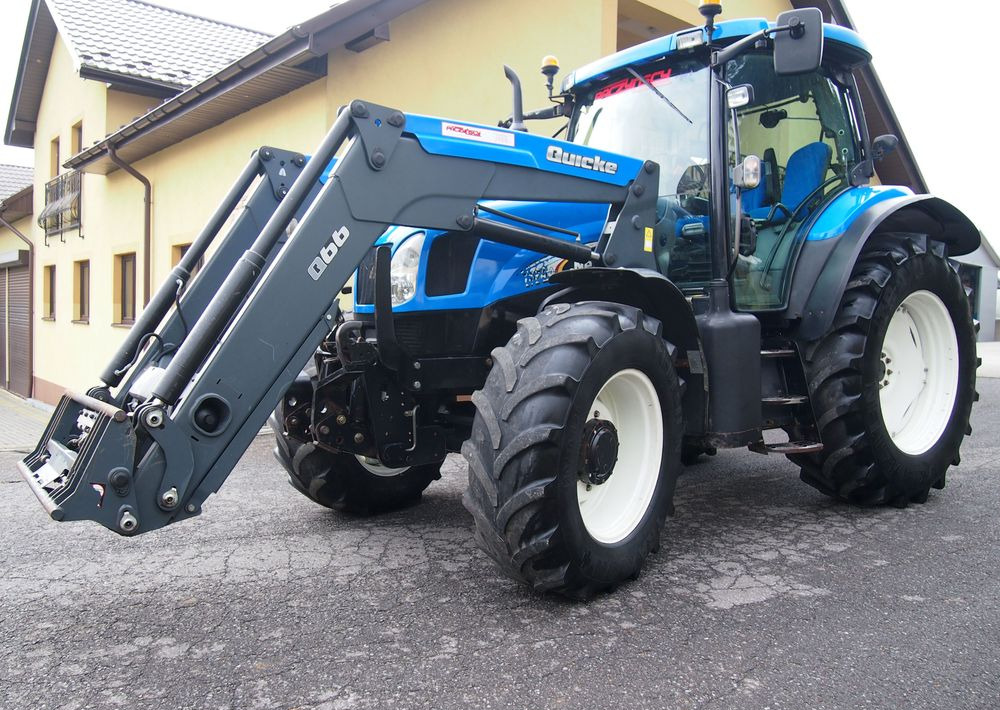 Ciągnik New Holland NH TS125A 6 cylindrów 2004 Ciągnik rolniczy New Holland TS125A - جرار: صور 1 Ciągnik New Holland NH TS125A 6 cylindrów 2004 Ciągnik rolniczy New Holland TS125A - جرار: صور 1