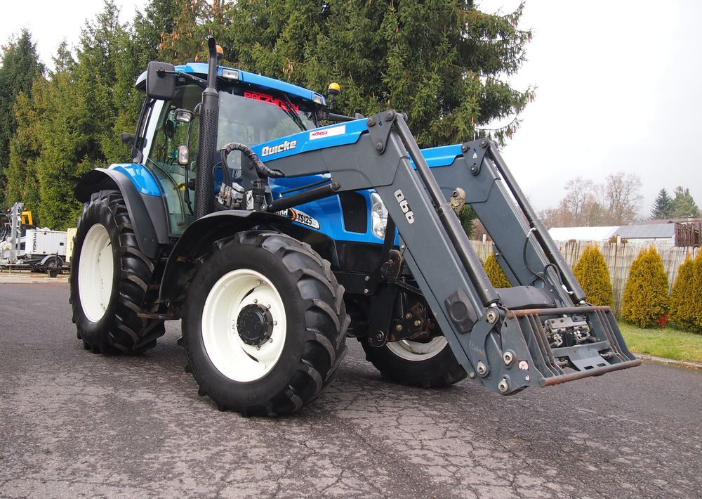 Ciągnik New Holland NH TS125A 6 cylindrów 2004 Ciągnik rolniczy New Holland TS125A - جرار: صور 2 Ciągnik New Holland NH TS125A 6 cylindrów 2004 Ciągnik rolniczy New Holland TS125A - جرار: صور 2