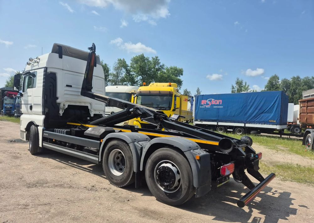 MAN TGX 26-460 Hakowiec oś skrętna - شاحنة ذات الخطاف: صور 1 MAN TGX 26-460 Hakowiec oś skrętna - شاحنة ذات الخطاف: صور 1