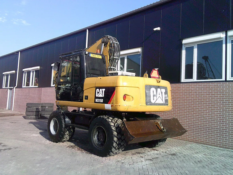 Caterpillar M315D - حفارة على عجلات: صور 2 Caterpillar M315D - حفارة على عجلات: صور 2