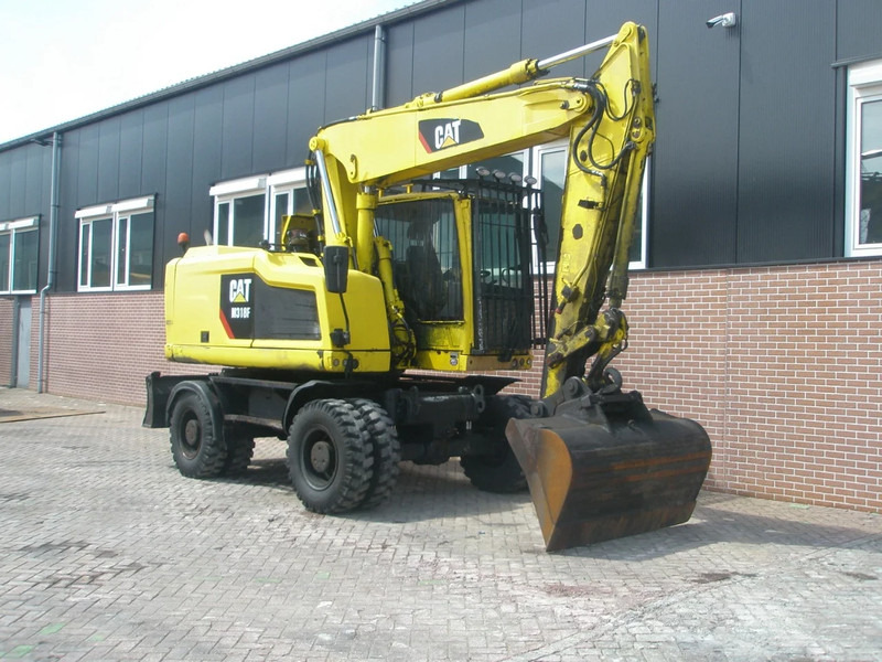 Caterpillar M318F - حفارة على عجلات: صور 4 Caterpillar M318F - حفارة على عجلات: صور 4