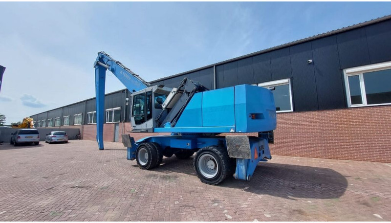 Fuchs MHL360 - حفارة النقل والشحن: صور 2 Fuchs MHL360 - حفارة النقل والشحن: صور 2