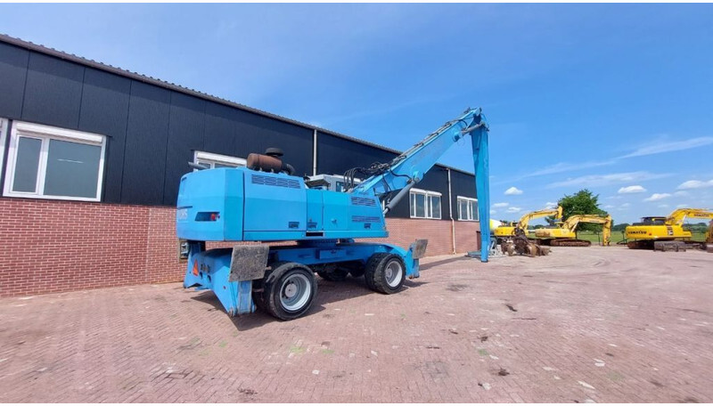Fuchs MHL360 - حفارة النقل والشحن: صور 4 Fuchs MHL360 - حفارة النقل والشحن: صور 4