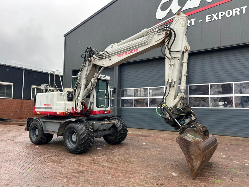 Takeuchi TB1160W - حفارة على عجلات: صور 2 Takeuchi TB1160W - حفارة على عجلات: صور 2