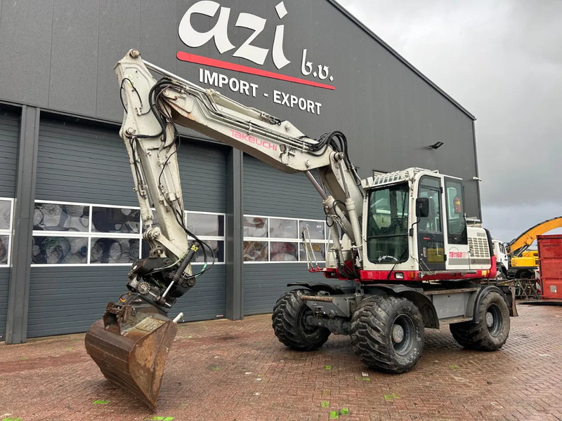 Takeuchi TB1160W - حفارة على عجلات: صور 1 Takeuchi TB1160W - حفارة على عجلات: صور 1