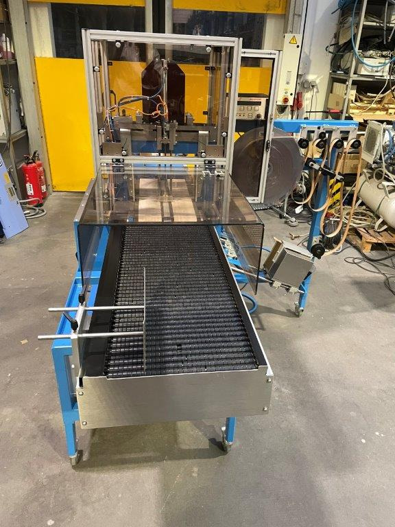 ATS Tanner UltraSonic US 2000-AB transit banding machine with pneumatic product hold-down and infeed roller table - آلة التعبئة والتغليف: صور 4 ATS Tanner UltraSonic US 2000-AB transit banding machine with pneumatic product hold-down and infeed roller table - آلة التعبئة والتغليف: صور 4