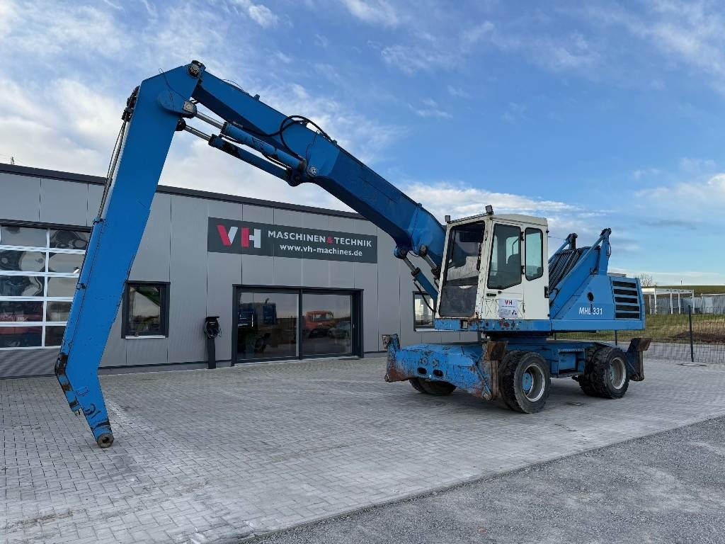 Fuchs MHL 331 - حفارة النقل والشحن: صور 1 Fuchs MHL 331 - حفارة النقل والشحن: صور 1