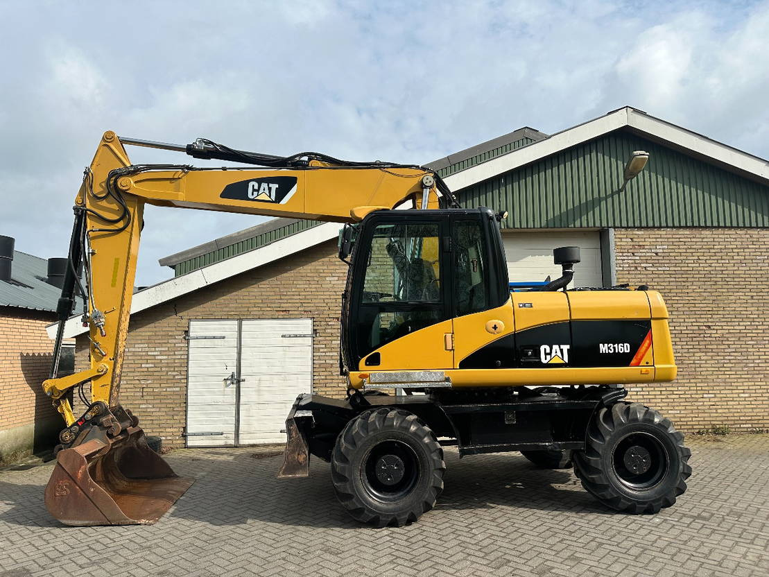 Caterpillar M316D - حفارة على عجلات: صور 1 Caterpillar M316D - حفارة على عجلات: صور 1