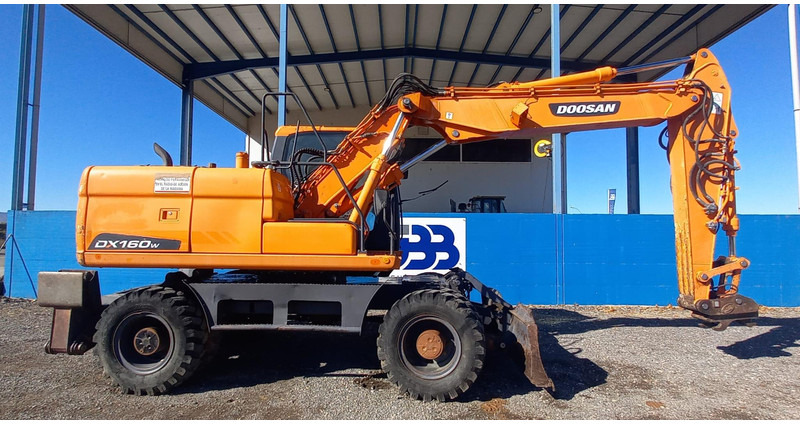Doosan DX140W-3 - حفارة على عجلات: صور 2 Doosan DX140W-3 - حفارة على عجلات: صور 2