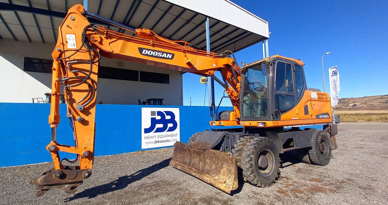 Doosan DX140W-3 - حفارة على عجلات: صور 5 Doosan DX140W-3 - حفارة على عجلات: صور 5
