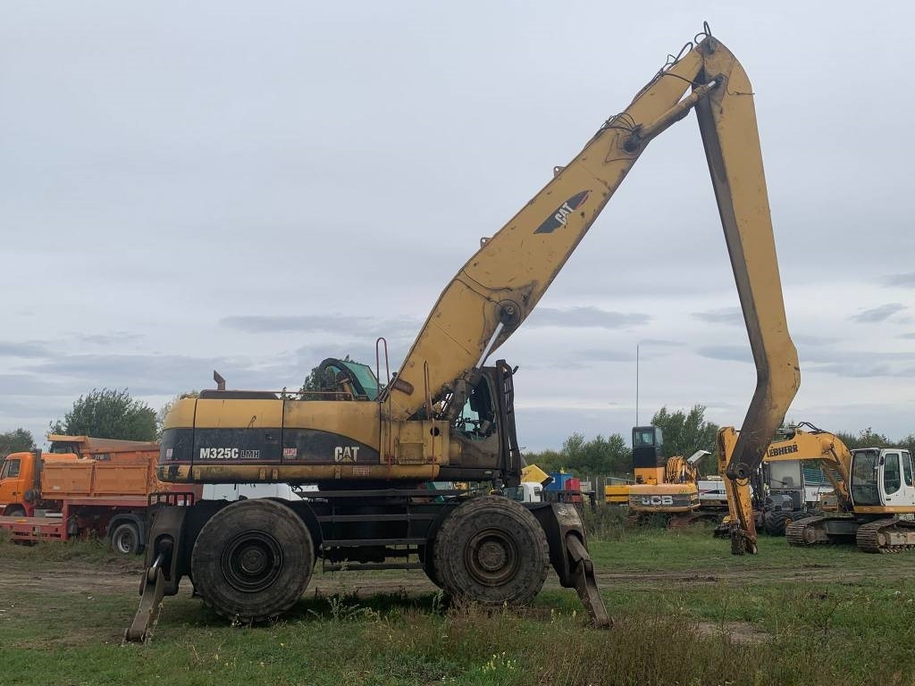CAT M 325 C L MH - حفارة النقل والشحن: صور 5 CAT M 325 C L MH - حفارة النقل والشحن: صور 5