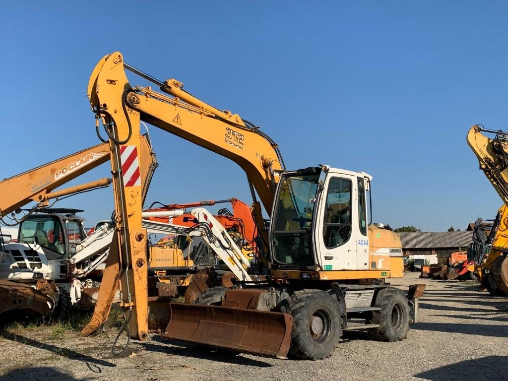Liebherr A 312 - حفارة على عجلات: صور 1 Liebherr A 312 - حفارة على عجلات: صور 1