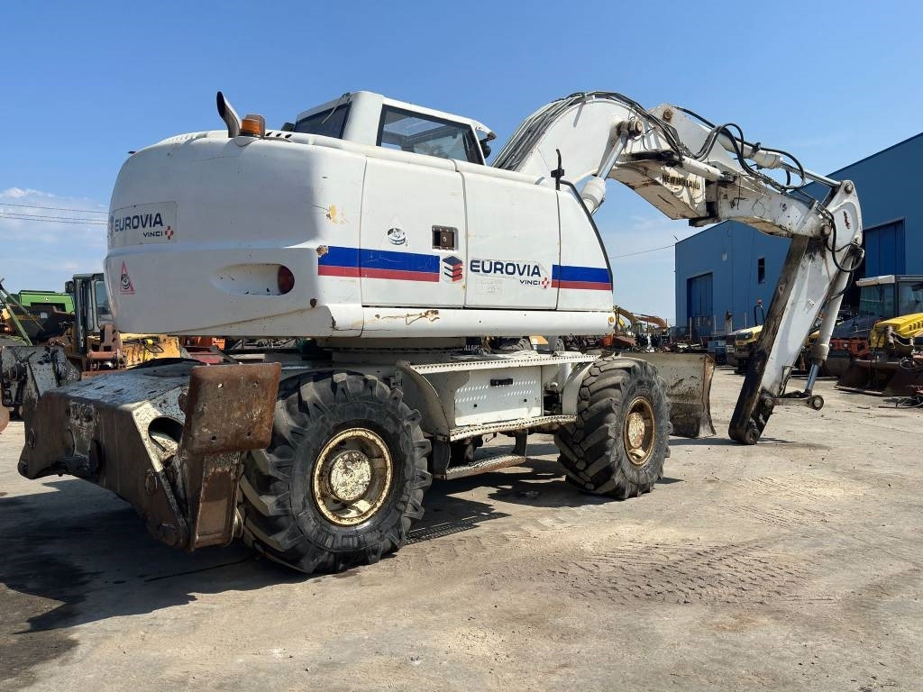 New Holland MH Plus - حفارة على عجلات: صور 4 New Holland MH Plus - حفارة على عجلات: صور 4
