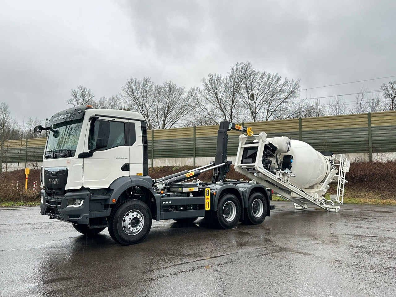 MAN TGS 33.440 6x4 Euro6e Abroller + Fahrmischer - شاحنة ذات الخطاف, شاحنة كرين: صور 1 MAN TGS 33.440 6x4 Euro6e Abroller + Fahrmischer - شاحنة ذات الخطاف, شاحنة كرين: صور 1