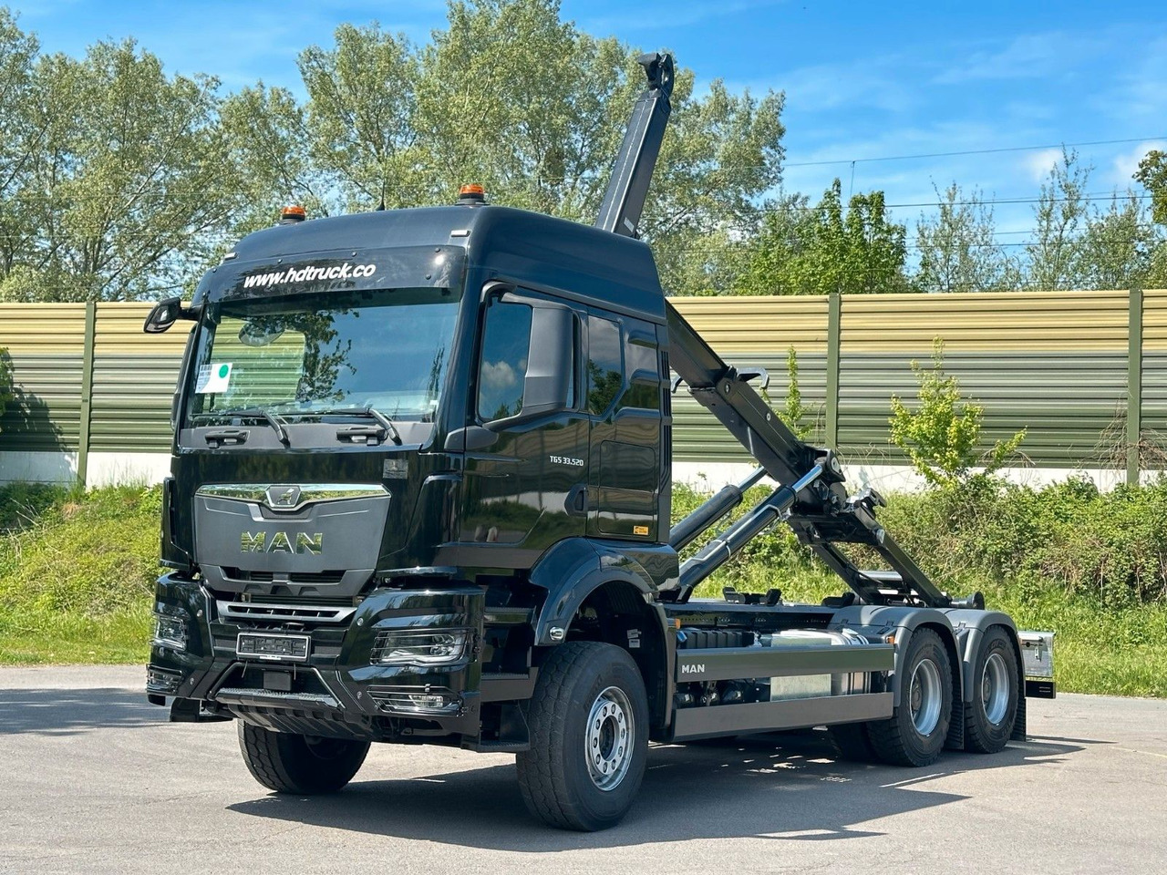 MAN TGS 33.520 6X4 Euro6e Abrollkipper MULTILIFT - شاحنة ذات الخطاف, شاحنة كرين: صور 1 MAN TGS 33.520 6X4 Euro6e Abrollkipper MULTILIFT - شاحنة ذات الخطاف, شاحنة كرين: صور 1