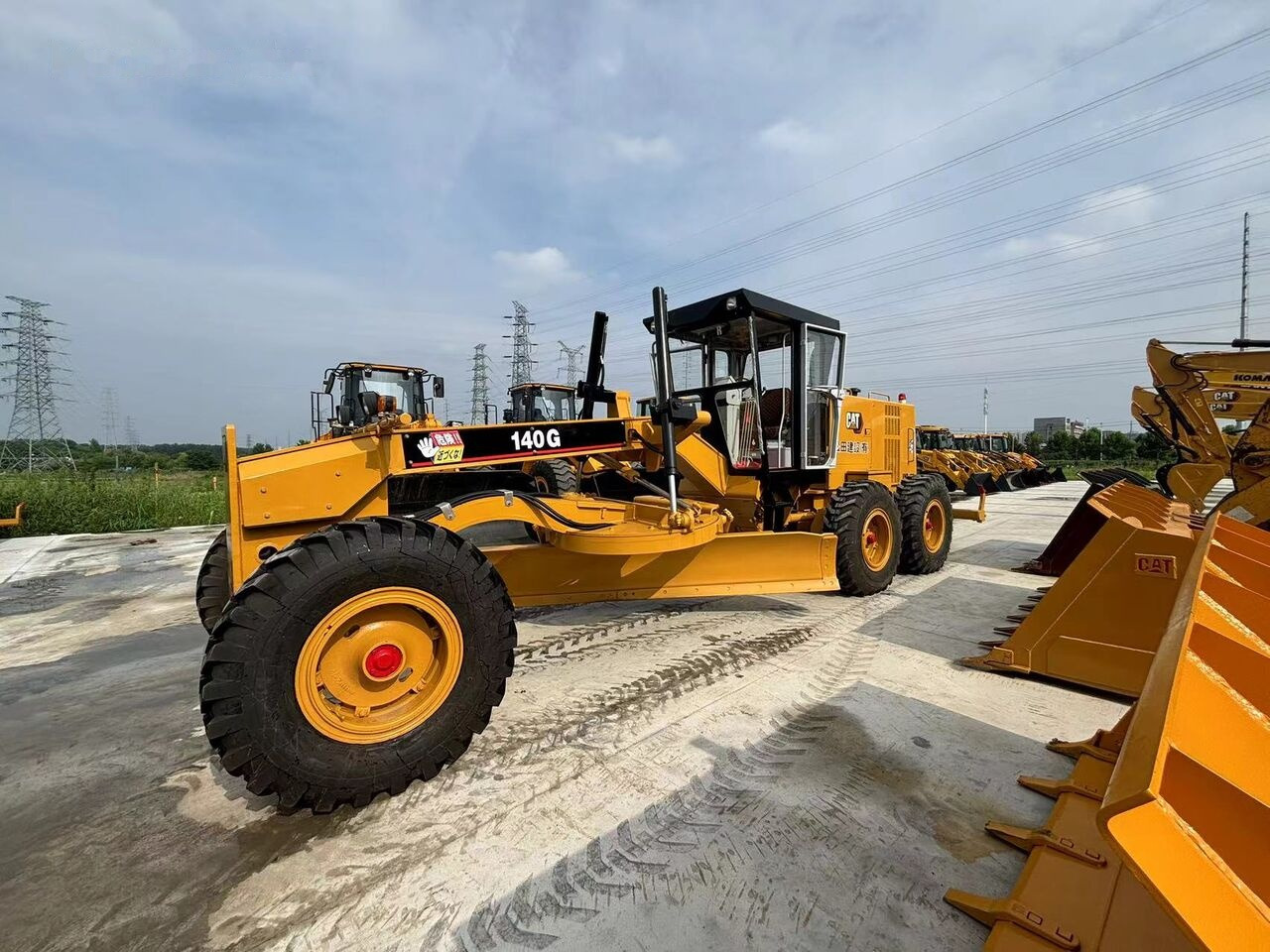 Caterpillar 140G - آلة تسوية الأرض: صور 1 Caterpillar 140G - آلة تسوية الأرض: صور 1
