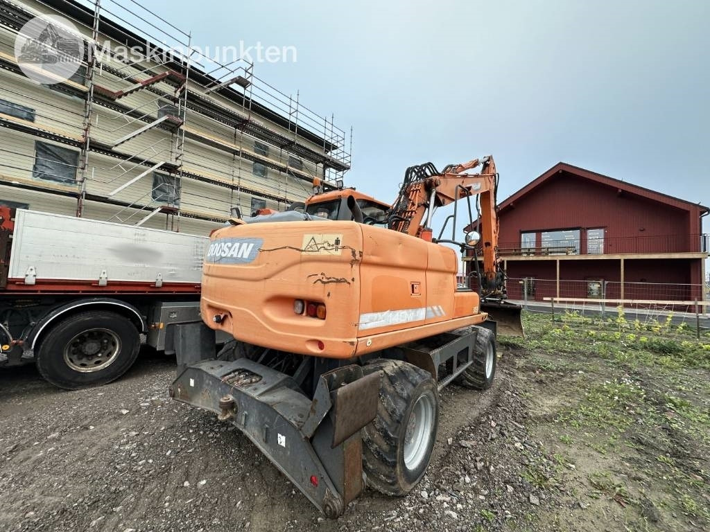 Doosan DX 140 W med vagn och redskap  - حفارة على عجلات: صور 4 Doosan DX 140 W med vagn och redskap  - حفارة على عجلات: صور 4