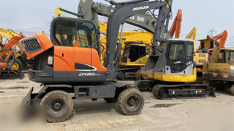 DOOSAN DX60W ECO - حفارة على عجلات: صور 1 DOOSAN DX60W ECO - حفارة على عجلات: صور 1