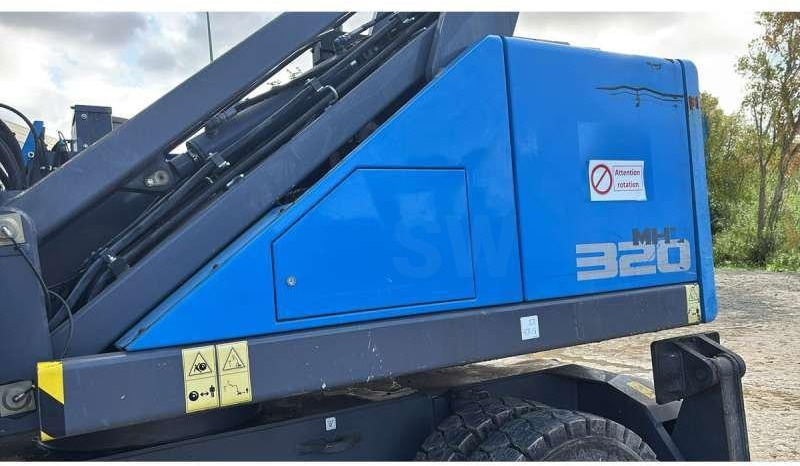 Fuchs MHL320F - حفارة النقل والشحن: صور 3 Fuchs MHL320F - حفارة النقل والشحن: صور 3