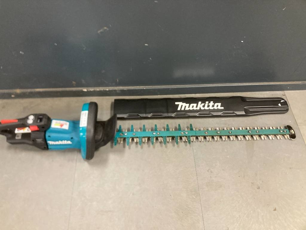 Makita Uh009g - سيارة بلدية: صور 1 Makita Uh009g - سيارة بلدية: صور 1