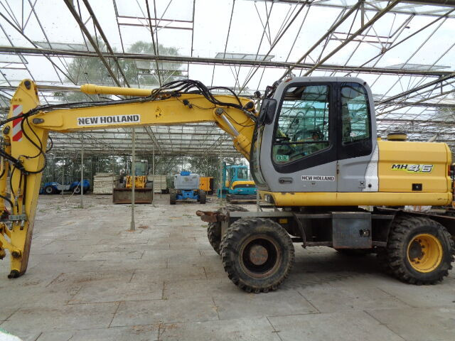 New Holland MH 4.6 - حفارة على عجلات: صور 1 New Holland MH 4.6 - حفارة على عجلات: صور 1