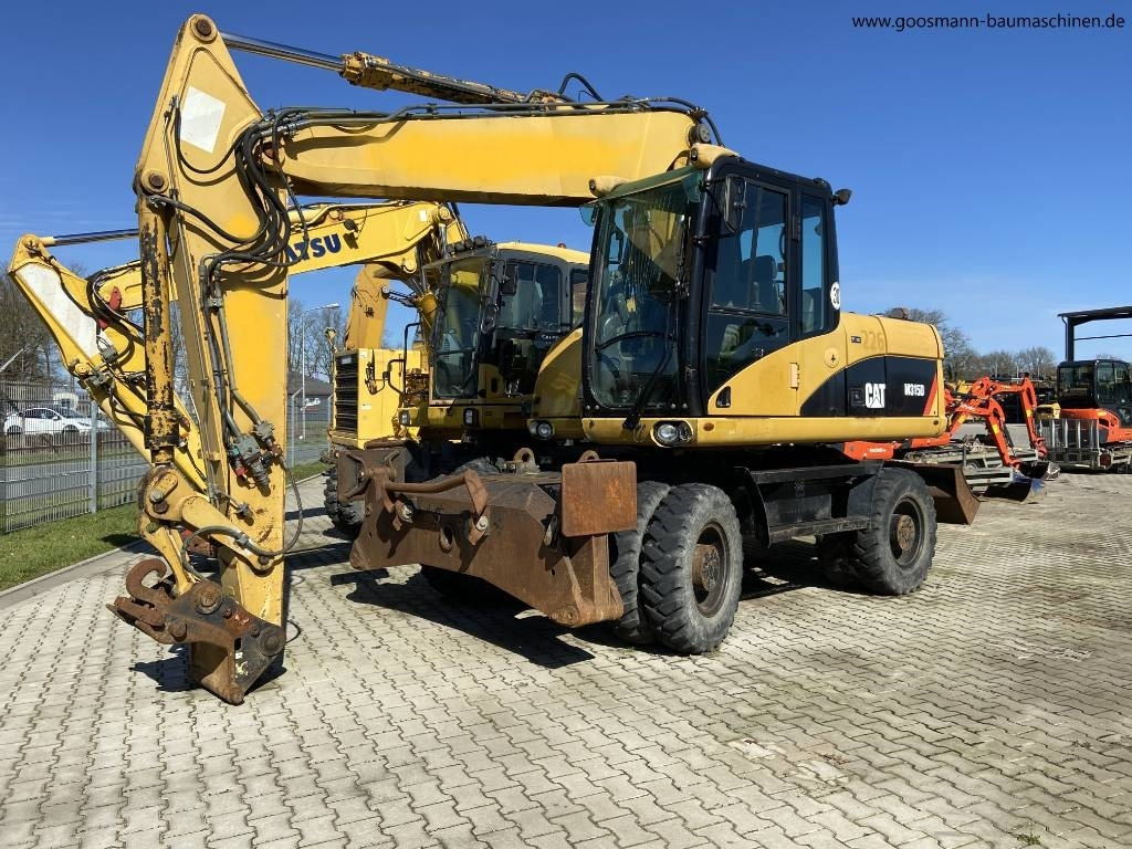 CAT M 315D - حفارة على عجلات: صور 1 CAT M 315D - حفارة على عجلات: صور 1