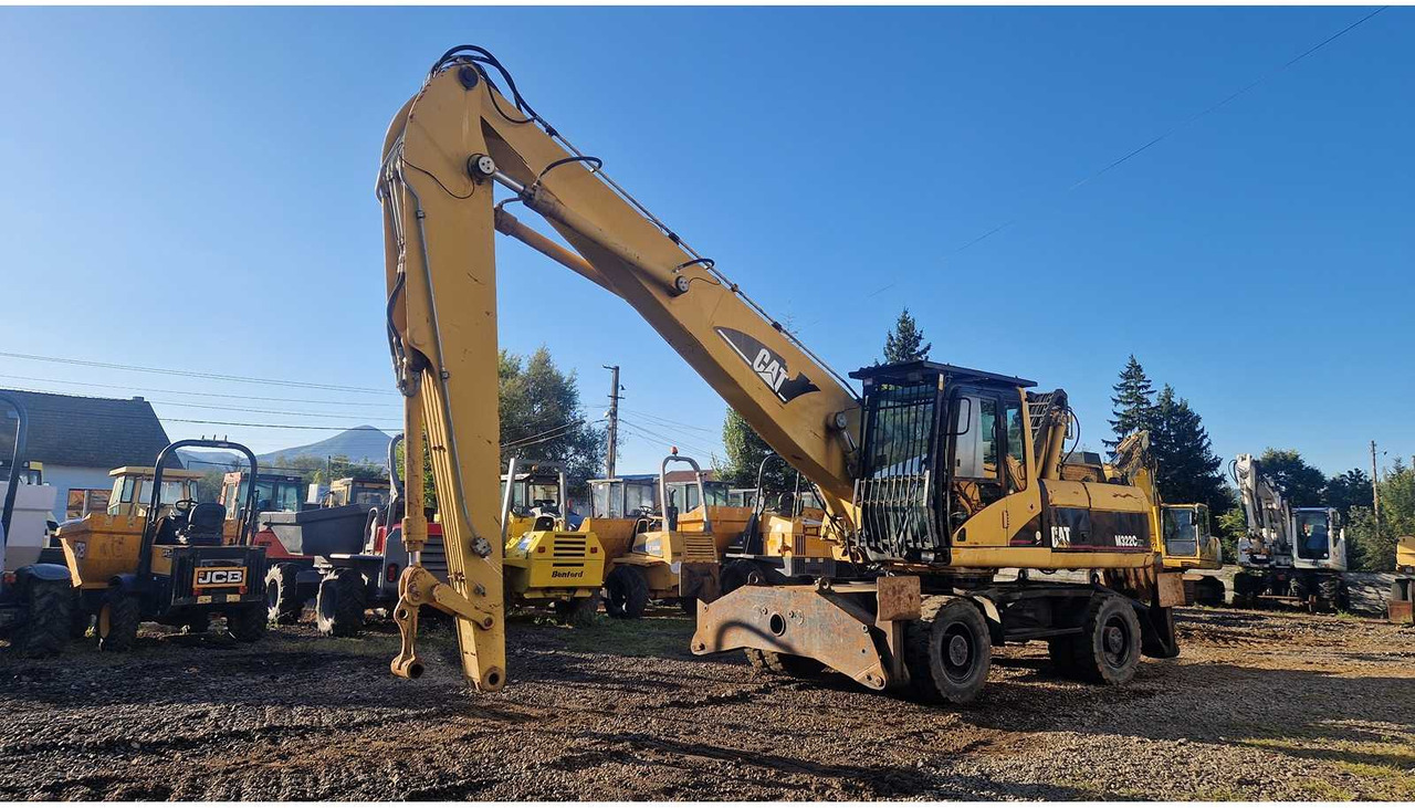 Caterpillar M322C - حفارة على عجلات: صور 1 Caterpillar M322C - حفارة على عجلات: صور 1