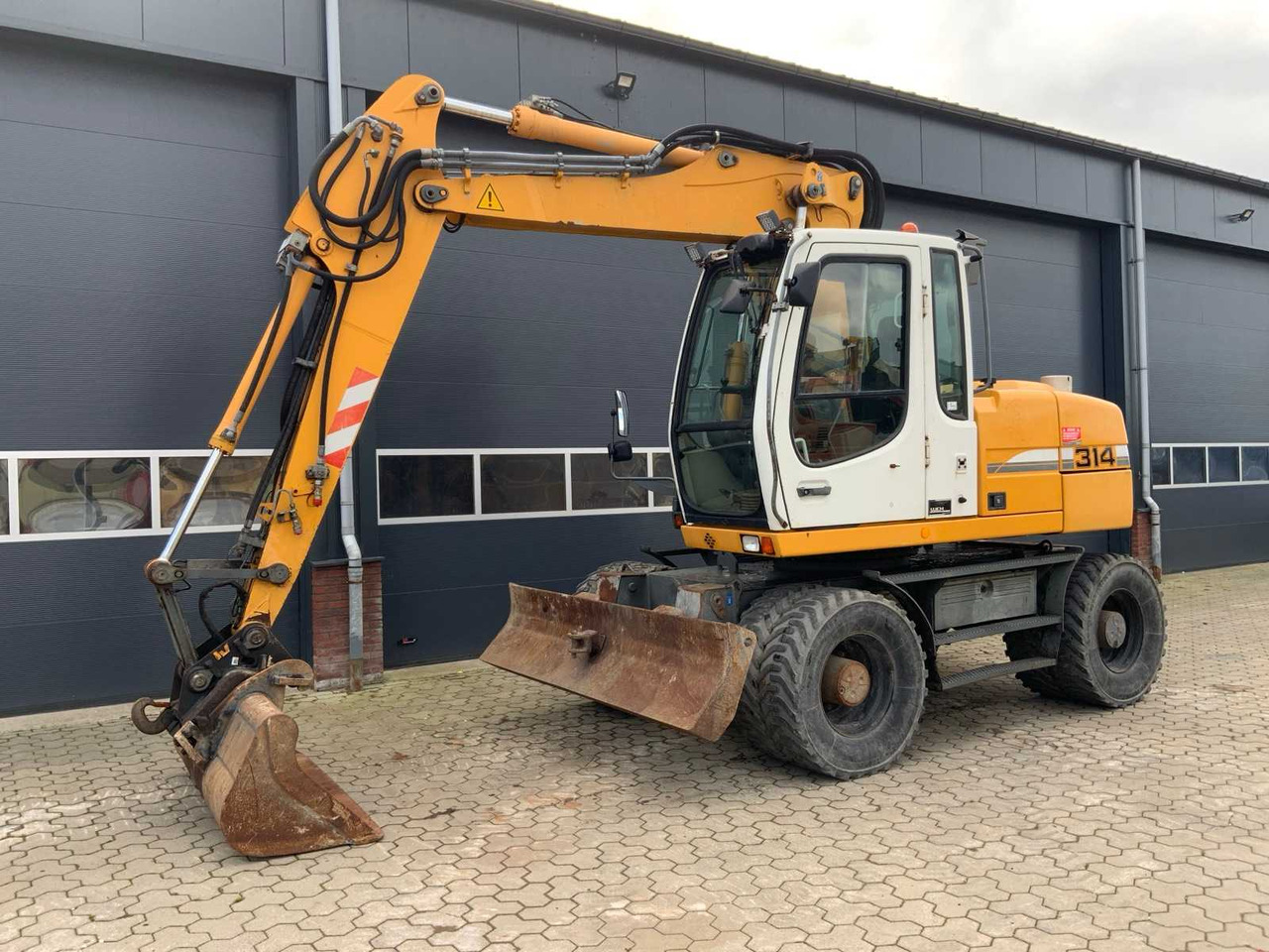 Liebherr A314 Litronic - حفارة على عجلات: صور 1 Liebherr A314 Litronic - حفارة على عجلات: صور 1