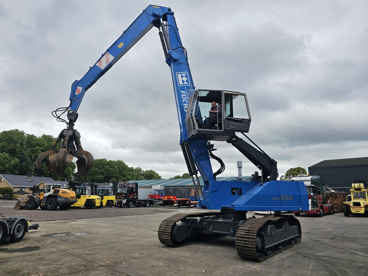 Fuchs RHL 350 Materialhandler With Adjustable Tracks - حفارة النقل والشحن: صور 1 Fuchs RHL 350 Materialhandler With Adjustable Tracks - حفارة النقل والشحن: صور 1