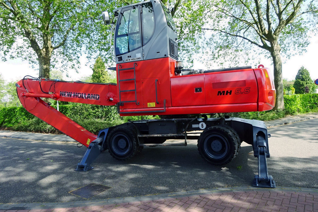New Holland MH 6.6 With Multi Purpose Stick And Magnet System - حفارة النقل والشحن: صور 5 New Holland MH 6.6 With Multi Purpose Stick And Magnet System - حفارة النقل والشحن: صور 5