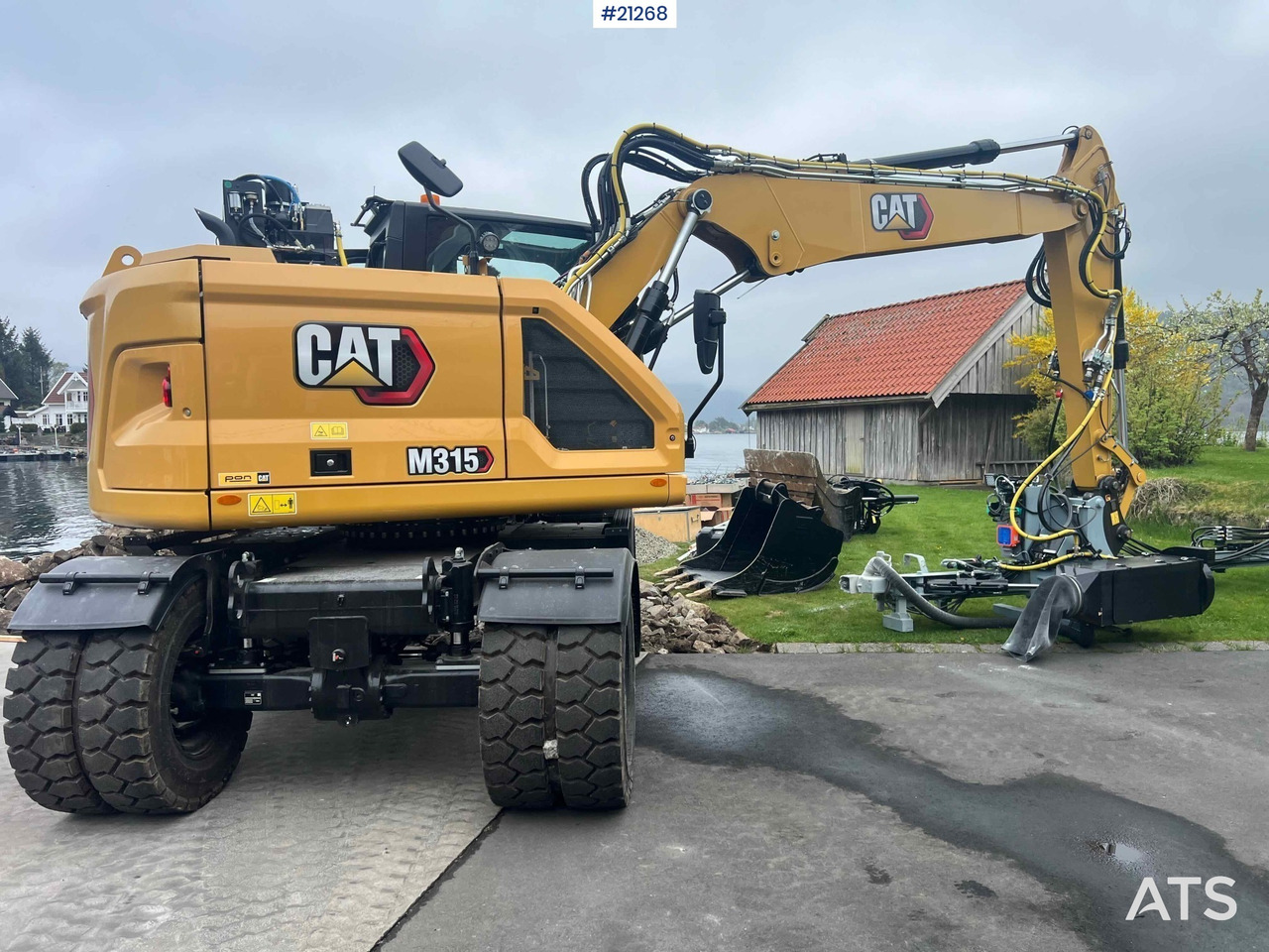 حفارة على عجلات CAT M315: صور 14